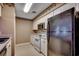 Compact kitchen with white cabinets, appliances, decorative border and neutral flooring at 808 Myrtle Ct. # 808, North Myrtle Beach, SC 29582