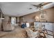 Open living area featuring a ceiling fan, glass table, sofa, recliner and a view to the dining area at 808 Myrtle Ct. # 808, North Myrtle Beach, SC 29582