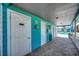 Pool area with a covered walkway featuring access doors and brick paving at 808 Myrtle Ct. # 808, North Myrtle Beach, SC 29582