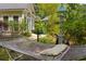 Secluded backyard featuring a comfortable hammock, lush landscaping and charming birdhouse post at 81 Prestwick Dr., Pawleys Island, SC 29585