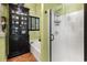 Well-appointed bathroom with a soaking tub, shower, and black cabinet, providing storage and style at 81 Prestwick Dr., Pawleys Island, SC 29585