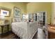Bright bedroom featuring a white bed frame and sliding glass doors to the outdoors at 81 Prestwick Dr., Pawleys Island, SC 29585