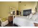 Spacious bedroom with hardwood floors, vaulted ceiling, and black closet doors creating a sleek interior at 81 Prestwick Dr., Pawleys Island, SC 29585