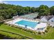Beautiful community pool and tennis courts surrounded by mature trees and manicured landscaping at 81 Prestwick Dr., Pawleys Island, SC 29585