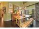Charming dining room features a unique table, chandelier lighting, and elegant decor at 81 Prestwick Dr., Pawleys Island, SC 29585