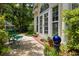 Charming patio area with outdoor seating, perfect for relaxing and enjoying the garden at 81 Prestwick Dr., Pawleys Island, SC 29585