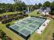 Community pickleball courts with a picturesque water view and mature trees, creating a serene sports setting at 81 Prestwick Dr., Pawleys Island, SC 29585