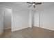 Spacious bedroom with a closet and attached bathroom featuring hardwood floors and neutral paint at 8148 Living Tide Dr., Myrtle Beach, SC 29572