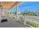 Inviting covered front porch with wood ceiling and detailed trim overlooks a landscaped street view at 8148 Living Tide Dr., Myrtle Beach, SC 29572