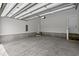 Spacious two-car garage with high ceilings, white walls, and concrete flooring at 8148 Living Tide Dr., Myrtle Beach, SC 29572