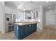 Well-equipped kitchen boasting a blue island with butcher block top and stainless steel appliances at 8148 Living Tide Dr., Myrtle Beach, SC 29572