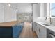 The well-appointed kitchen showcases a blue island with butcher block top, modern fixtures and stainless appliances at 8148 Living Tide Dr., Myrtle Beach, SC 29572