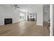 Spacious living room with hardwood floors, fireplace, and abundant natural light from large windows at 8148 Living Tide Dr., Myrtle Beach, SC 29572
