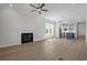 Spacious living area featuring a fireplace, ceiling fan and an open layout to the kitchen at 8148 Living Tide Dr., Myrtle Beach, SC 29572