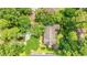 Aerial view of large landscaped home surrounded by lush green trees and manicured lawns at 89 Cameron Ct., Pawleys Island, SC 29585