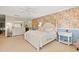 Bright bedroom with a white bed, patterned wallpaper, and ample natural light at 89 Cameron Ct., Pawleys Island, SC 29585