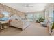 Comfortable bedroom with floral wallpaper, a plush bed, and natural light at 89 Cameron Ct., Pawleys Island, SC 29585