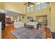 Bright living room with soaring ceilings, hardwood floors, and stylish furniture at 89 Cameron Ct., Pawleys Island, SC 29585