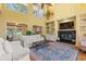 Spacious living room with fireplace, built-in shelving, and an abundance of natural light at 89 Cameron Ct., Pawleys Island, SC 29585