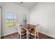 Corner dining area with wood floors, natural light and simple table with seating at 892 Harrison St., Myrtle Beach, SC 29579