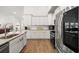 Contemporary kitchen with stainless steel appliances, granite countertops, and white cabinetry at 892 Harrison St., Myrtle Beach, SC 29579