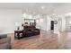 Spacious living room with hardwood floors and comfortable seating that leads to an open-concept kitchen at 892 Harrison St., Myrtle Beach, SC 29579