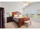 Spacious primary bedroom featuring vaulted ceilings, ceiling fan, and large window for lots of light at 892 Harrison St., Myrtle Beach, SC 29579