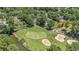 Gorgeous aerial view of a meticulously maintained golf course community with ponds and luxurious homes at 90 Old Carriage Ln., Pawleys Island, SC 29585