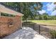 Backyard with a patio, a view of the golf course, and a brick exterior at 90 Old Carriage Ln., Pawleys Island, SC 29585