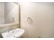 Charming half bathroom with a decorative mirror and a stylish, elegant sink at 90 Old Carriage Ln., Pawleys Island, SC 29585