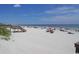 Expansive sandy beach with clear blue skies, gentle waves, and a wooden boardwalk for easy access at 90 Old Carriage Ln., Pawleys Island, SC 29585