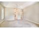 Spacious bedroom with ceiling fan, neutral carpet, and access to an ensuite bathroom at 90 Old Carriage Ln., Pawleys Island, SC 29585