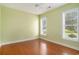 Bright bedroom with hardwood floors and two large windows at 90 Old Carriage Ln., Pawleys Island, SC 29585