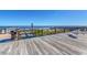 Inviting wooden deck overlooking the ocean, complete with seating, a shower, and a scenic view at 90 Old Carriage Ln., Pawleys Island, SC 29585