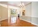 Spacious living room featuring a fireplace, a ceiling fan, and large windows with outdoor views at 90 Old Carriage Ln., Pawleys Island, SC 29585