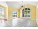 Bright sunroom with tile flooring, large windows, and access to an outdoor patio area at 90 Old Carriage Ln., Pawleys Island, SC 29585