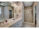 Bathroom featuring a double vanity, shower with glass doors and a large mirror, great for getting ready at 911 Tilghman Forest Dr., North Myrtle Beach, SC 29582