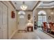 Inviting foyer featuring tile floors, decorative trim and molding, leading to the formal dining room at 911 Tilghman Forest Dr., North Myrtle Beach, SC 29582