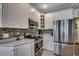 Well-equipped kitchen featuring stainless appliances, tile backsplash, and ample counter space at 911 Tilghman Forest Dr., North Myrtle Beach, SC 29582