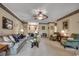 Spacious living room featuring neutral walls, a ceiling fan, and comfortable furnishings at 911 Tilghman Forest Dr., North Myrtle Beach, SC 29582