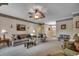 Comfortable living room with a ceiling fan, neutral tones, and plenty of seating for guests at 911 Tilghman Forest Dr., North Myrtle Beach, SC 29582