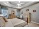 Comfortable main bedroom featuring a ceiling fan and two dressers, providing ample storage and space at 911 Tilghman Forest Dr., North Myrtle Beach, SC 29582