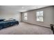 Spacious bedroom featuring neutral walls, carpet flooring, and two windows at 960 Corn Husk Loop, Conway, SC 29527