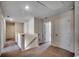 Second floor hallway with carpet, railing, and several white doors at 960 Corn Husk Loop, Conway, SC 29527
