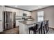Modern kitchen featuring stainless steel appliances, granite countertops, and a breakfast bar at 960 Corn Husk Loop, Conway, SC 29527