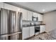 Contemporary kitchen with stainless steel appliances, granite countertops, and white cabinetry at 960 Corn Husk Loop, Conway, SC 29527