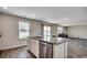 Kitchen island featuring granite countertops, stainless steel dishwasher and sink at 960 Corn Husk Loop, Conway, SC 29527