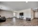 Spacious living room featuring neutral walls, wood-look flooring, and ample natural light at 960 Corn Husk Loop, Conway, SC 29527