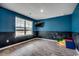 Stylish room with a large window, sleek floors, and chalkboard accent wall at 960 Corn Husk Loop, Conway, SC 29527