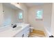 Bathroom featuring a long vanity and mirror with a built in bathtub and toilet at 974 Crooked Oak Dr., Pawleys Island, SC 29585